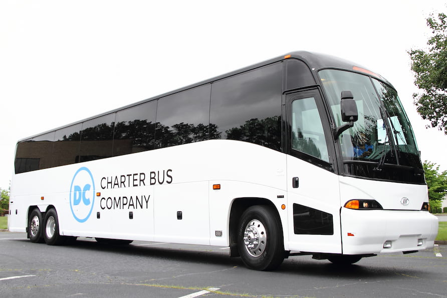 a charter bus with the dc charter bus company logo